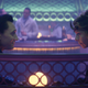 Loki and Sylvie, sitting in a booth.